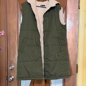 Long lined vest with lining and hood.